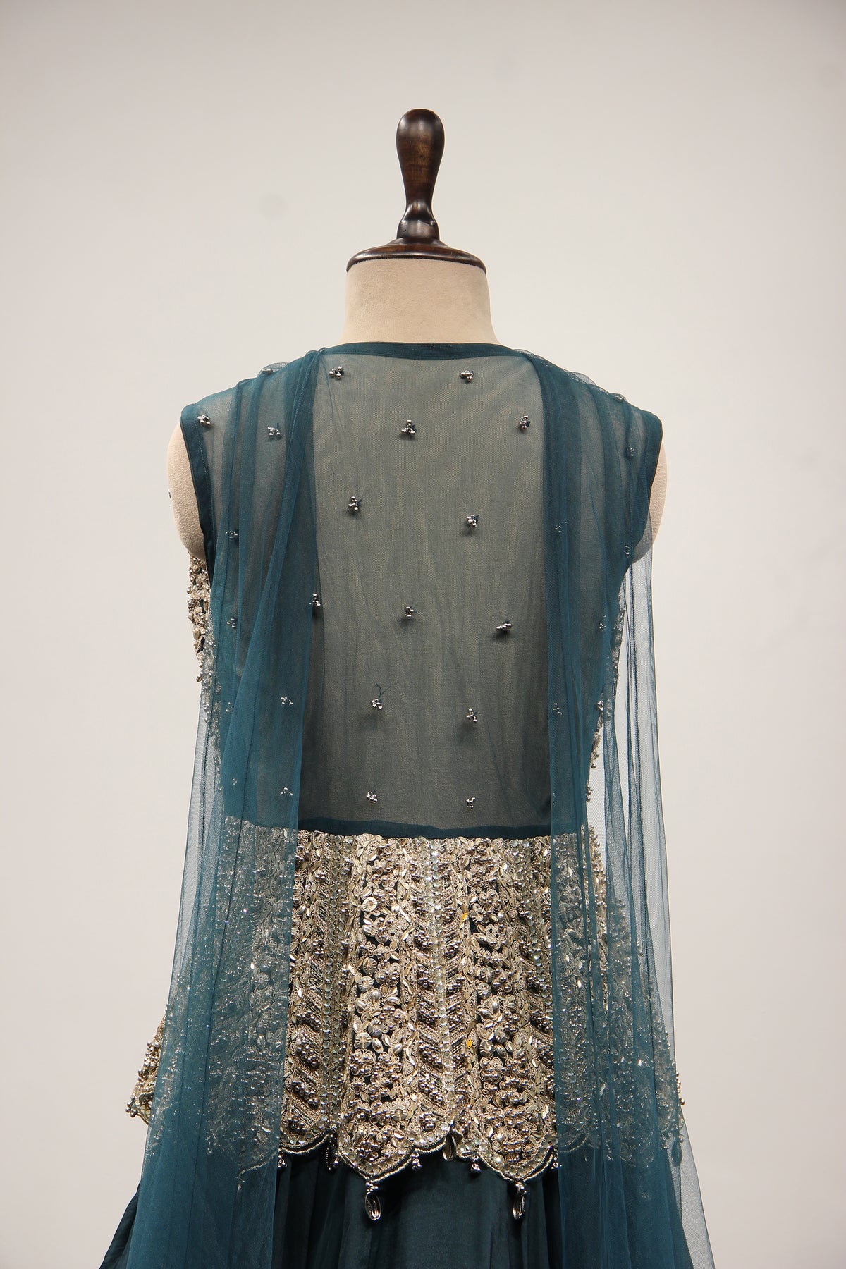 Bottle Green Organza Peplum Lehenga with Zari & Cut Dana Handwork – back close-up