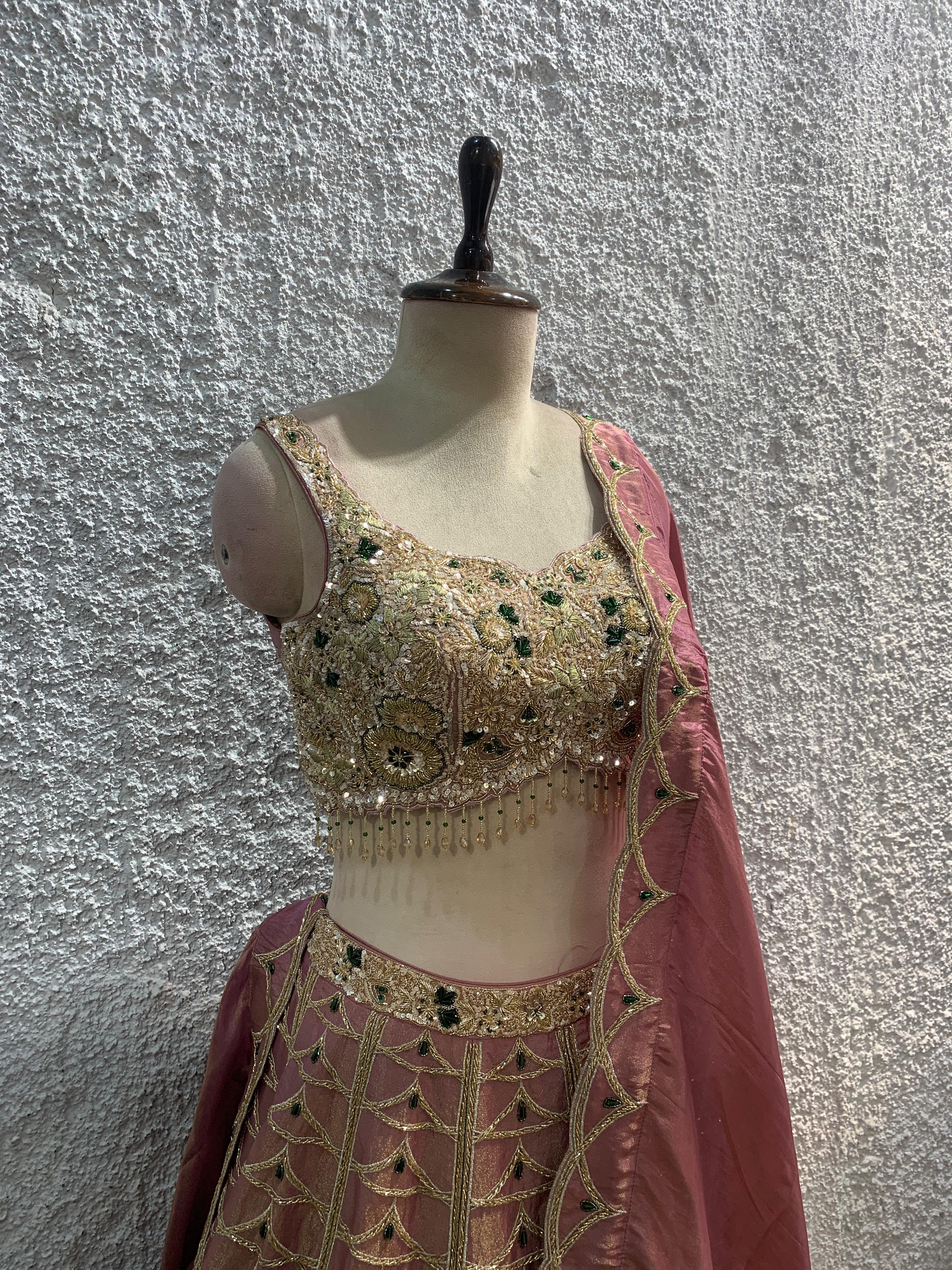 pink shimmer tissue Lehenga with green stone +embroidery lehenga with handwork blouse by OOS – women's ethnic wear – back view
