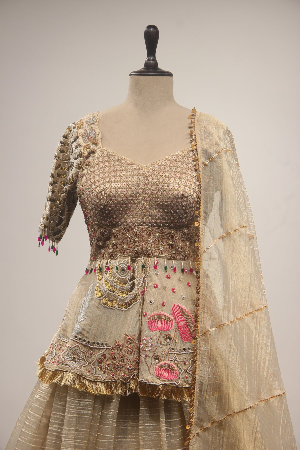 Gold Tissue Lehenga with Peplum Blouse & Cut Dana Bead Handwork