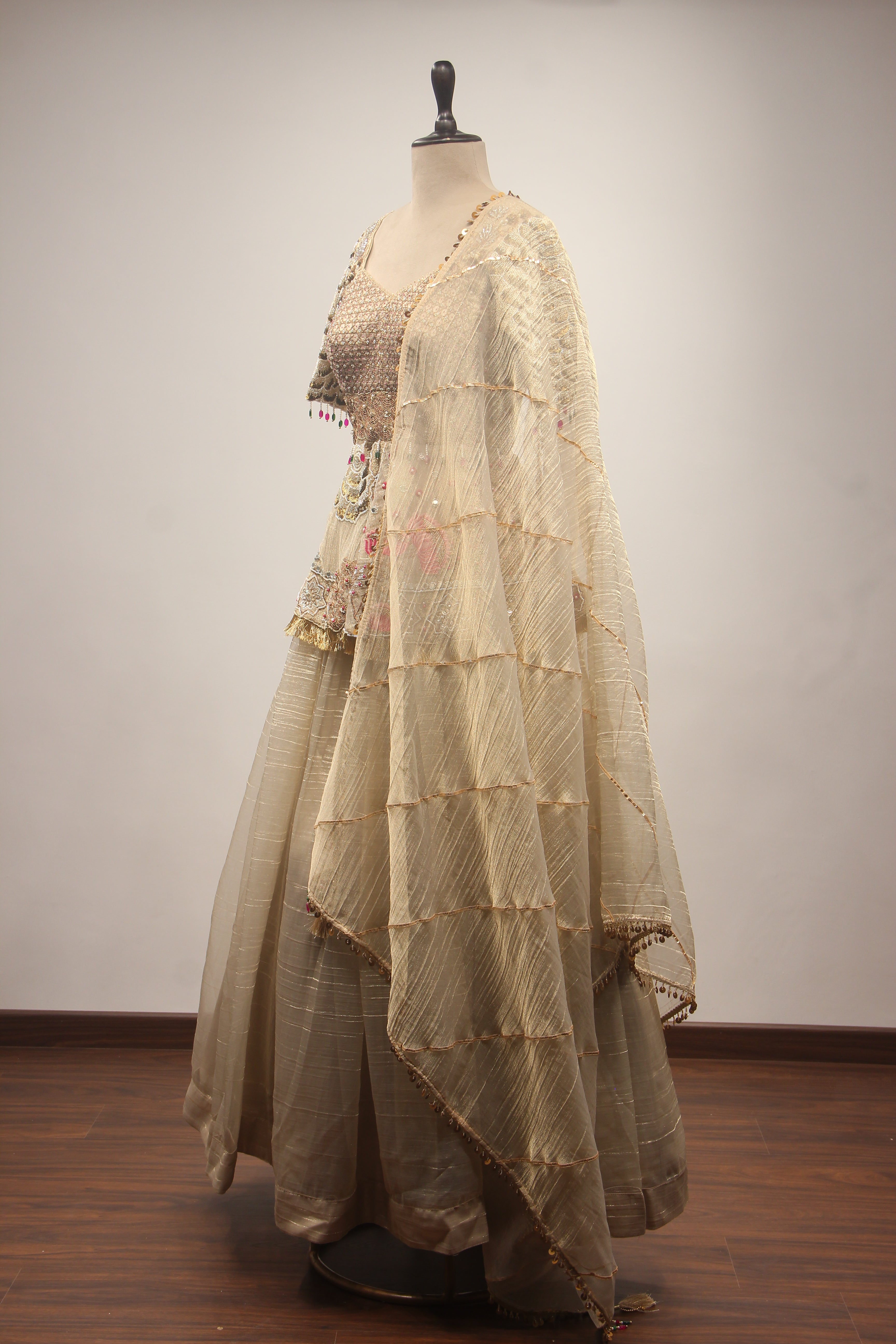 Gold Tissue Lehenga with Peplum Blouse & Cut Dana Bead Handwork