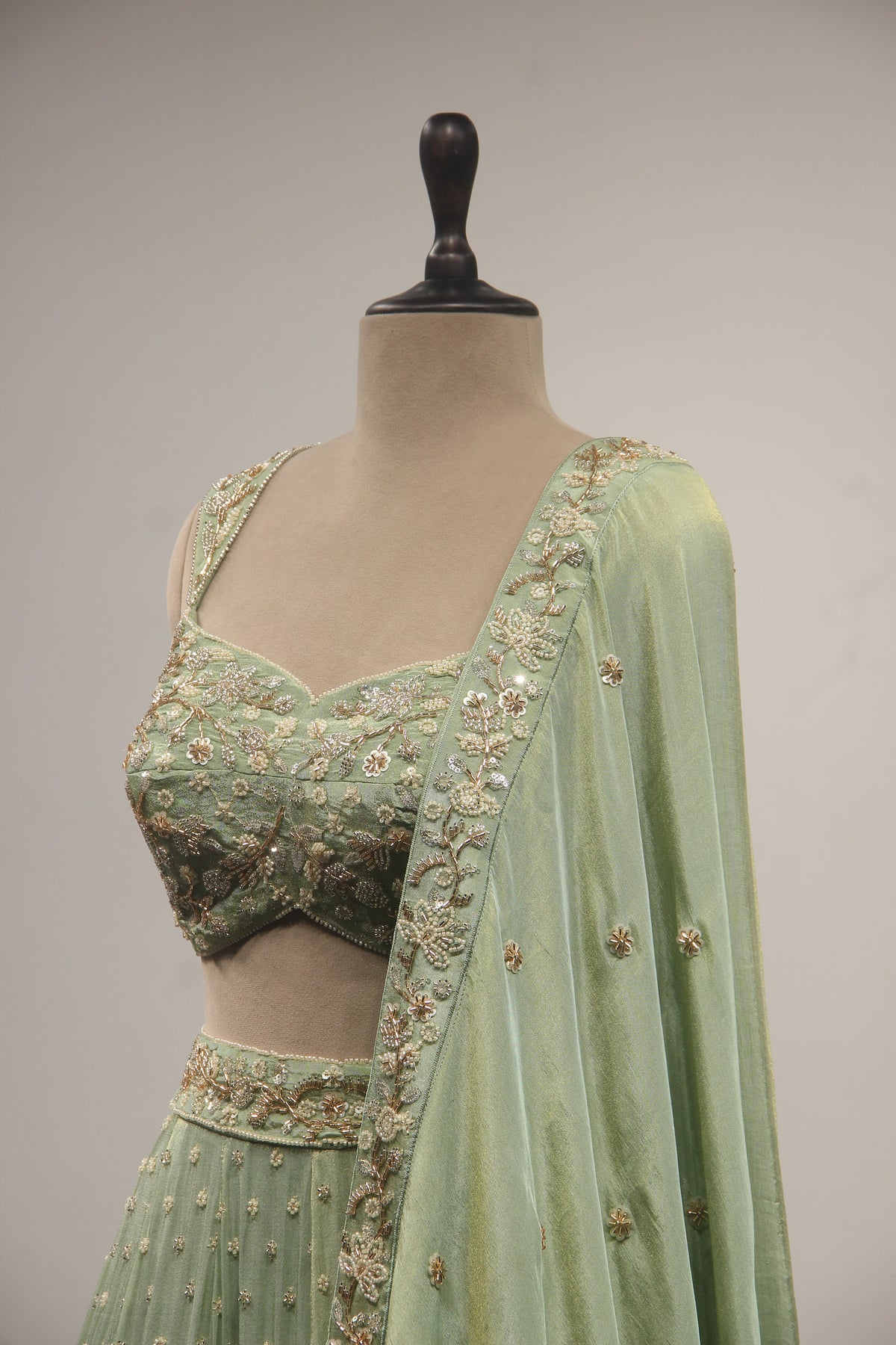 Pista Green Tissue Lehenga with Cut Dana & Bead Handwork Crop Top
