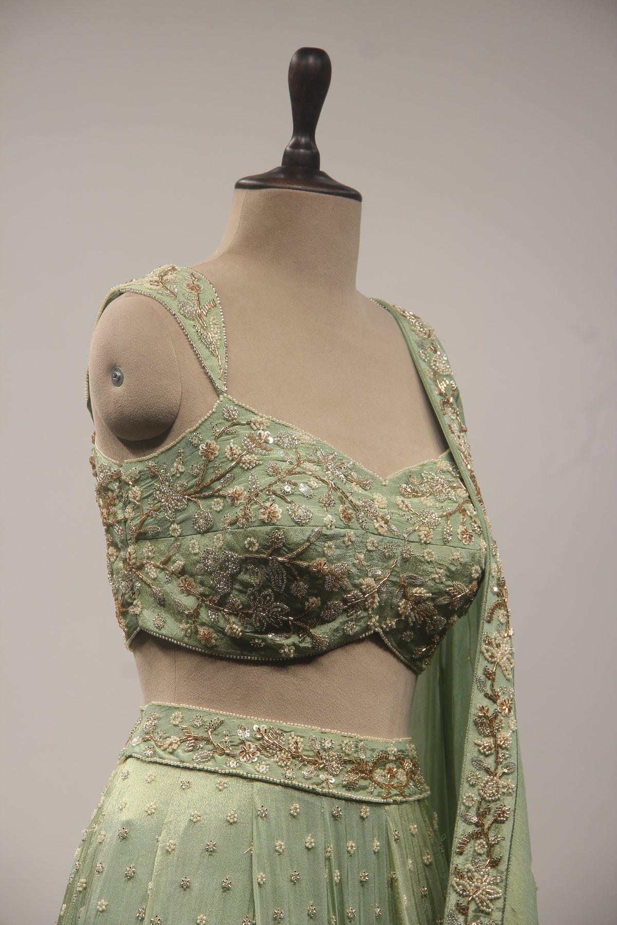 Pista Green Tissue Lehenga with Cut Dana & Bead Handwork Crop Top