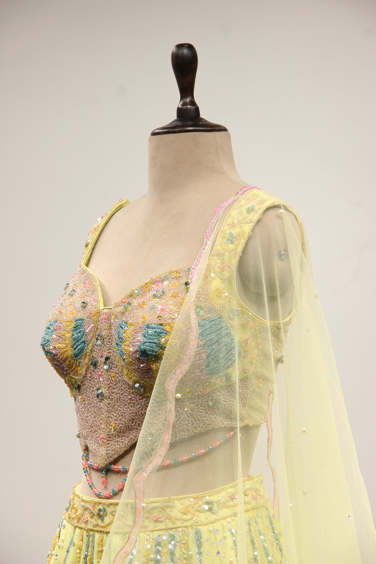 Pista Green Dupion Lehenga with Mirror & Cut Dana Handwork Net Corset – side close-up