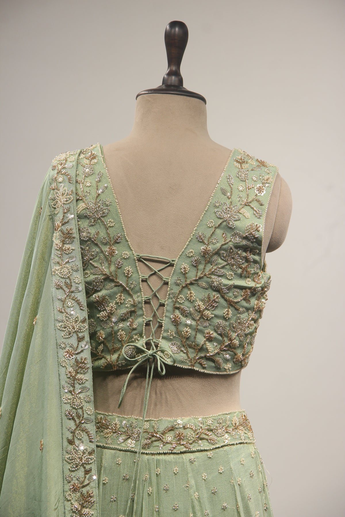 Pista Green Tissue Lehenga with Cut Dana & Bead Handwork Crop Top