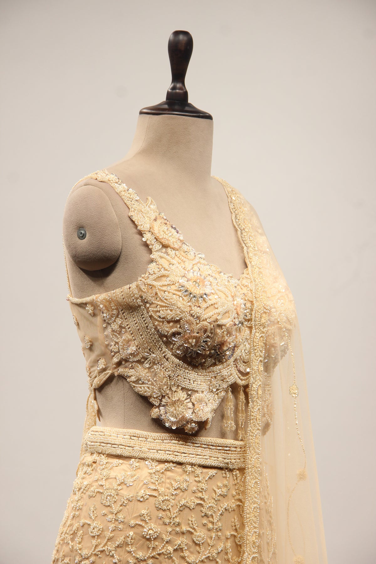 Net Mermaid Lehenga with Sequin & Cut Dana Handwork and Floral Bodice in Gold – other side close-up