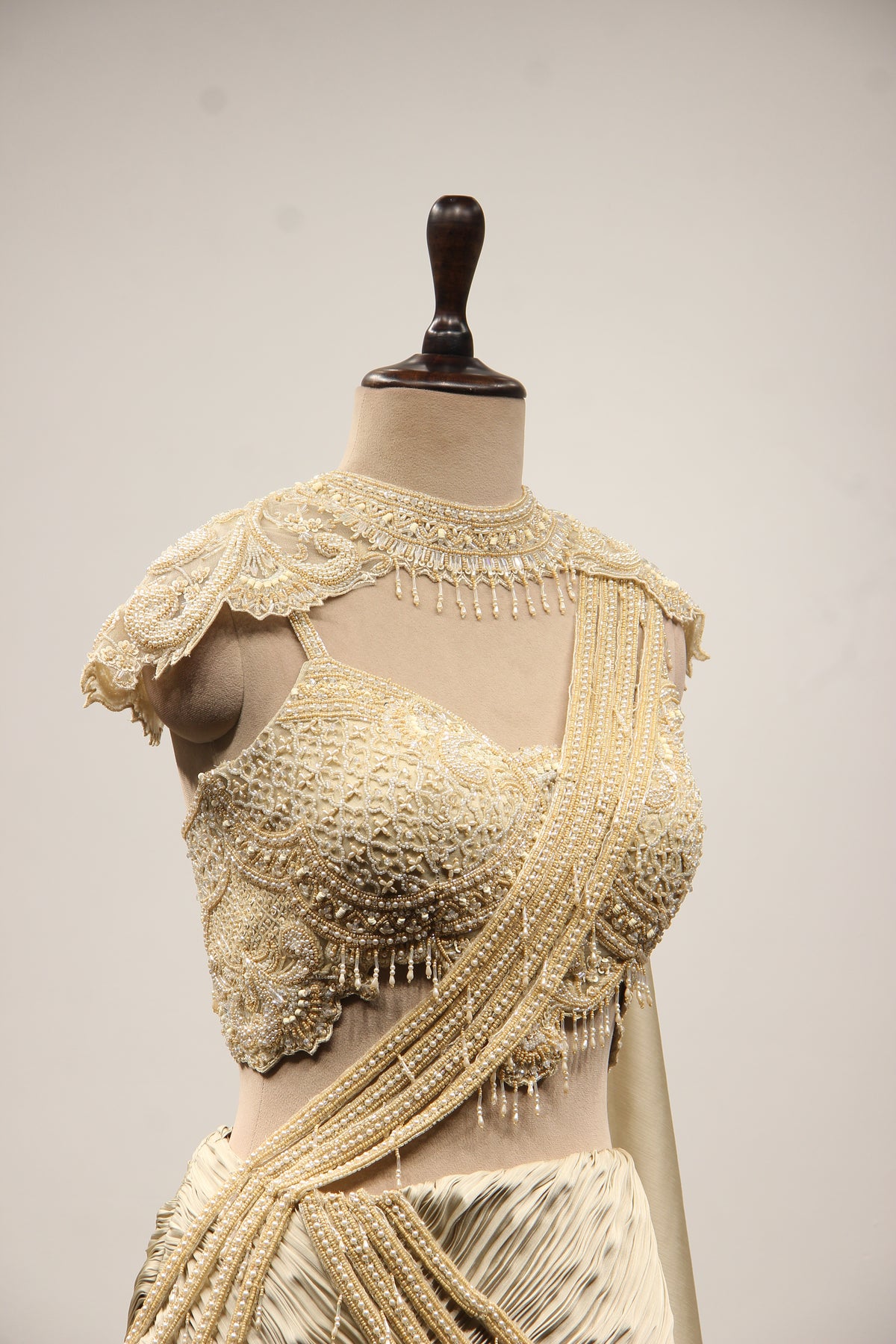 Ivory Satin Drape Skirt Lehenga with Bead & Pearl Handwork Crop Top – other side close-up, with cape