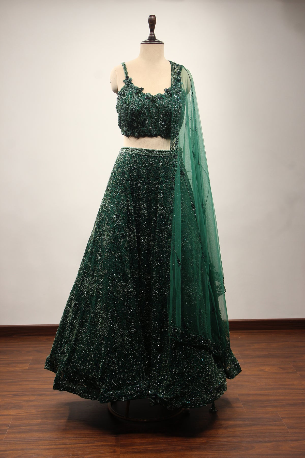 Bottle Green Net Lehenga with Cut Dana & Sequin Handwork Crop Top – front view