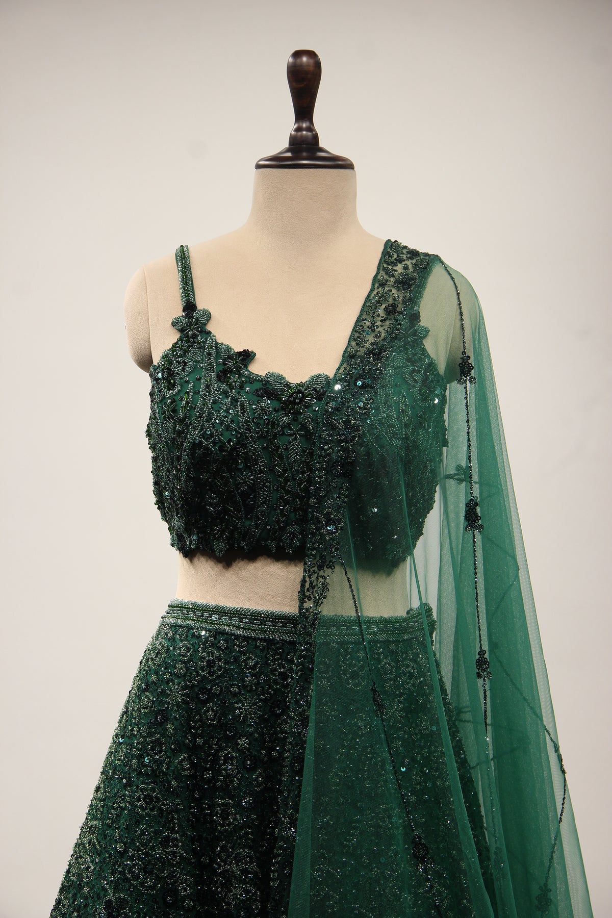 Bottle Green Net Lehenga with Cut Dana & Sequin Handwork Crop Top – front close-up
