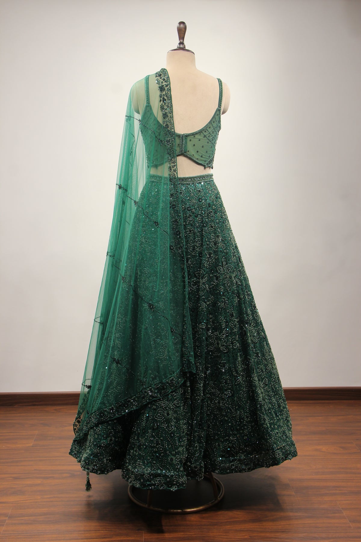 Bottle Green Net Lehenga with Cut Dana & Sequin Handwork Crop Top – back view