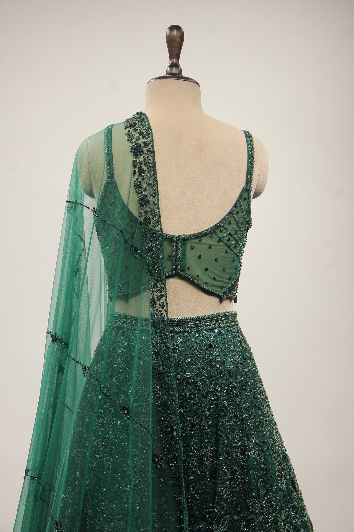 Bottle Green Net Lehenga with Cut Dana & Sequin Handwork Crop Top – back close-up