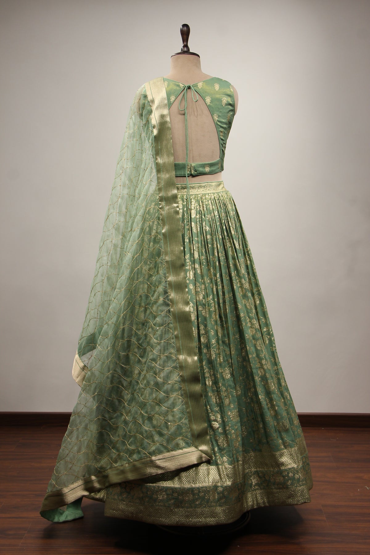 Green Banarsi Brocade Lehenga with Stone & Tassel Handwork Halter Neck