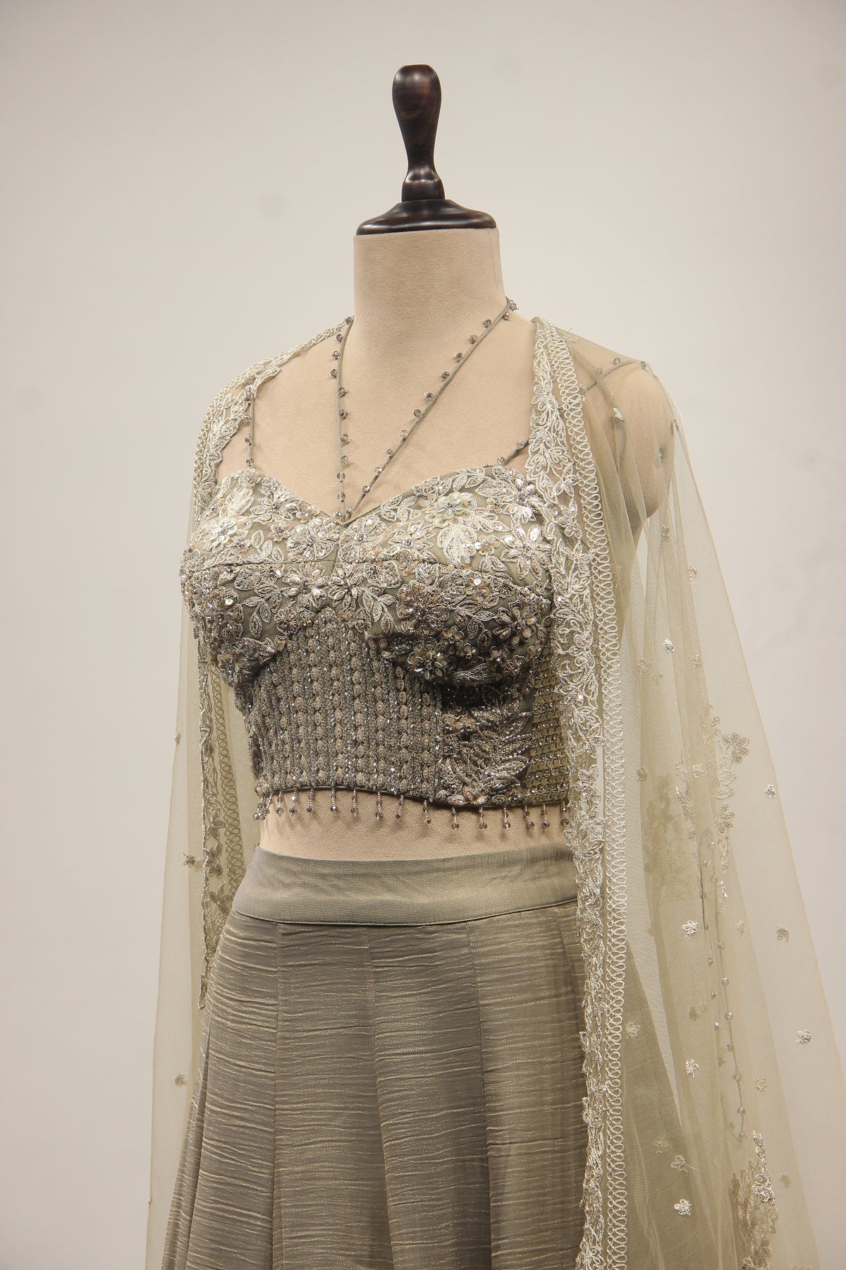 Grey Tissue Corset Lehenga with Sequin & Stone Handwork and Net Shrug – side close-up, with shrug