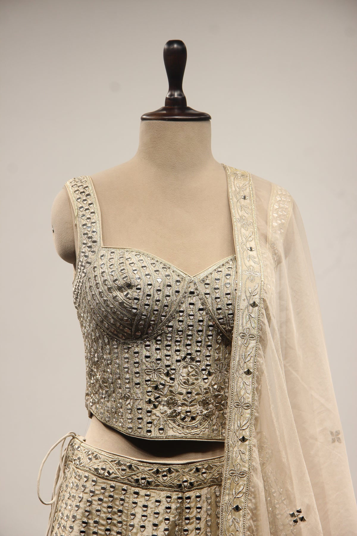 Grey Tissue Lehenga with Mirror & Zari Handwork Sweetheart Corset – front close-up