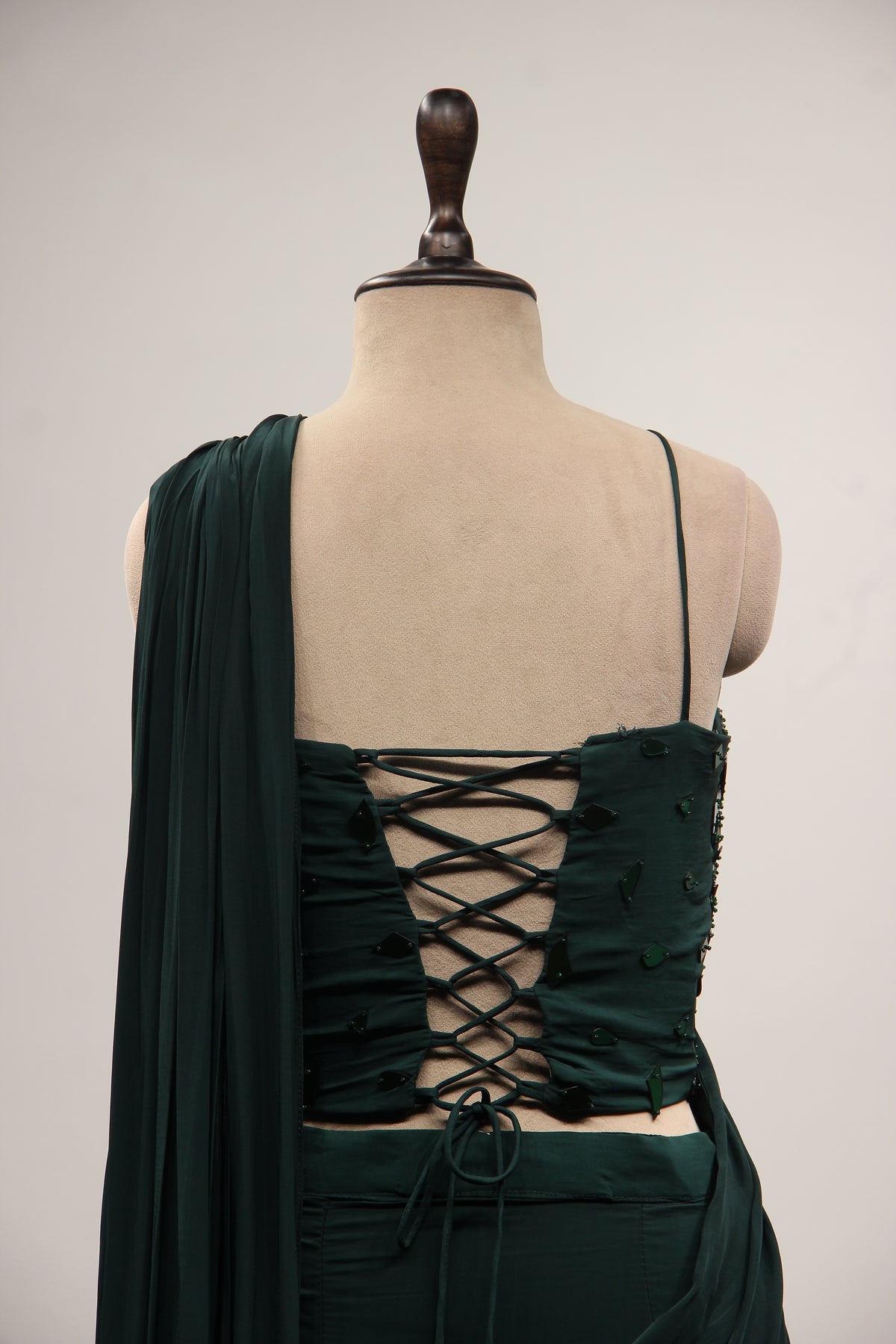 Bottle Green Crepe Drape Saree with Mirror & Bead Handwork Corset – back close-up