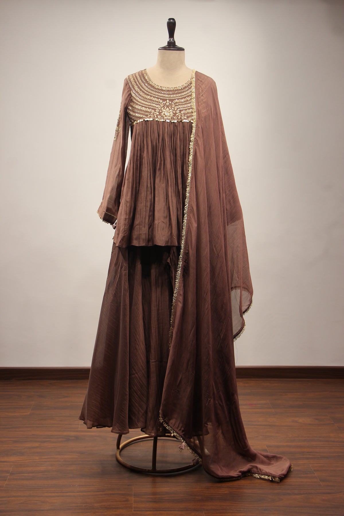 Chanderi Peplum Sharara Suit with Sequin & Zari Handwork Yoke in Brown – front view