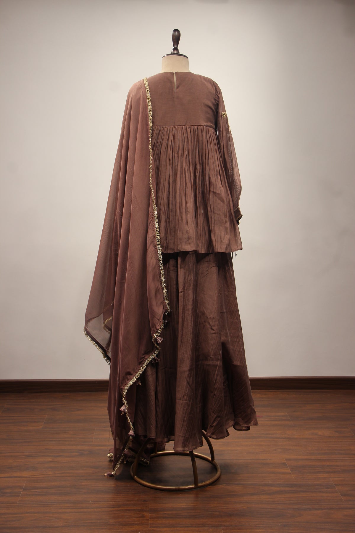Chanderi Peplum Sharara Suit with Sequin & Zari Handwork Yoke in Brown – back view