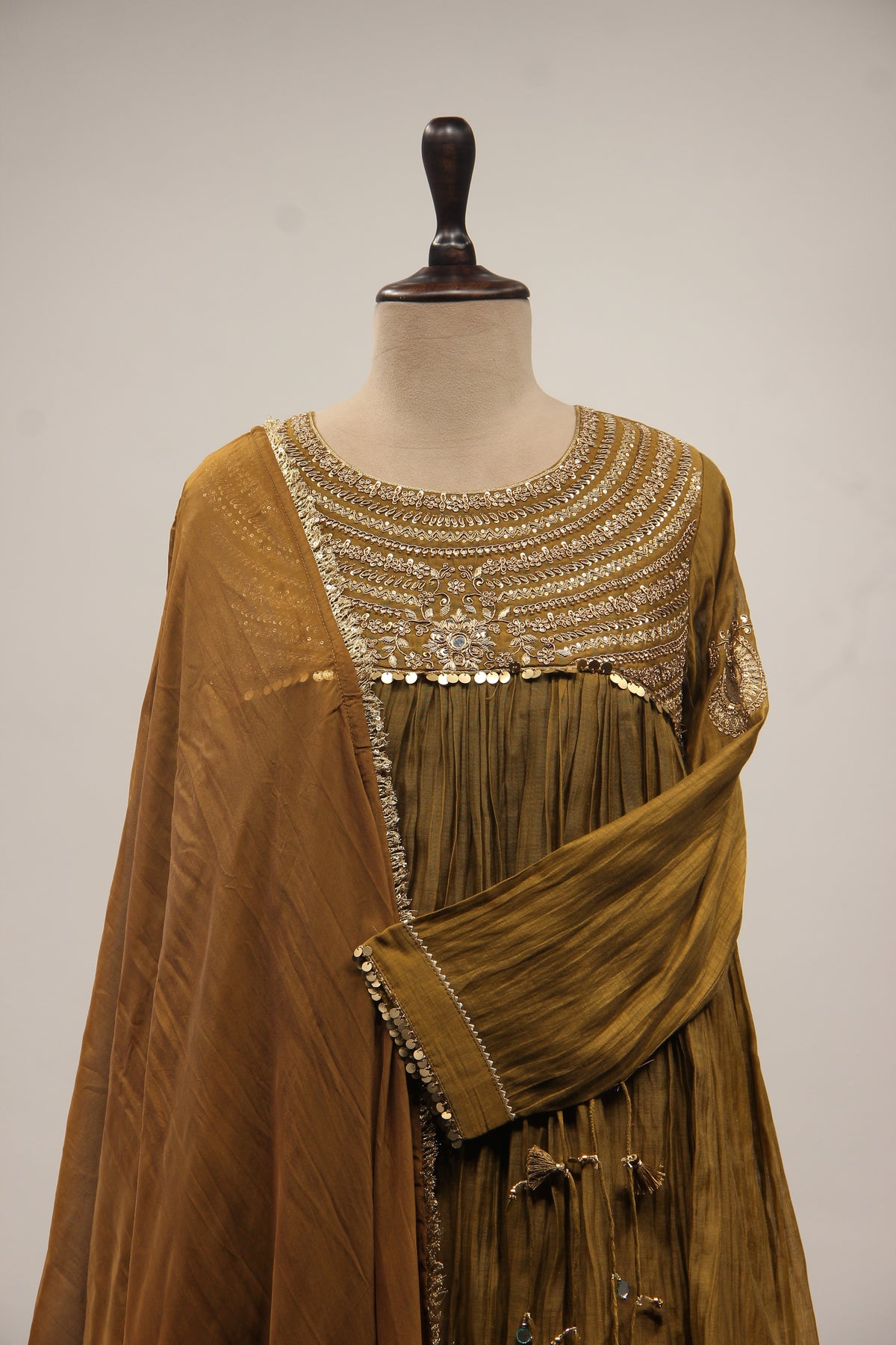 Chanderi Peplum Sharara Suit with Sequin & Zari Handwork Yoke in Green – front close-up