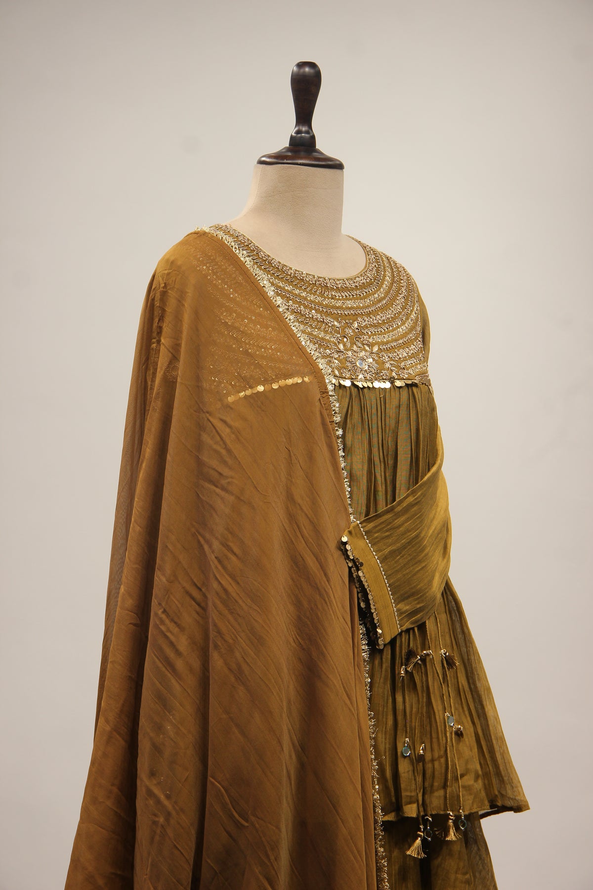 Chanderi Peplum Sharara Suit with Sequin & Zari Handwork Yoke in Green – side close-up