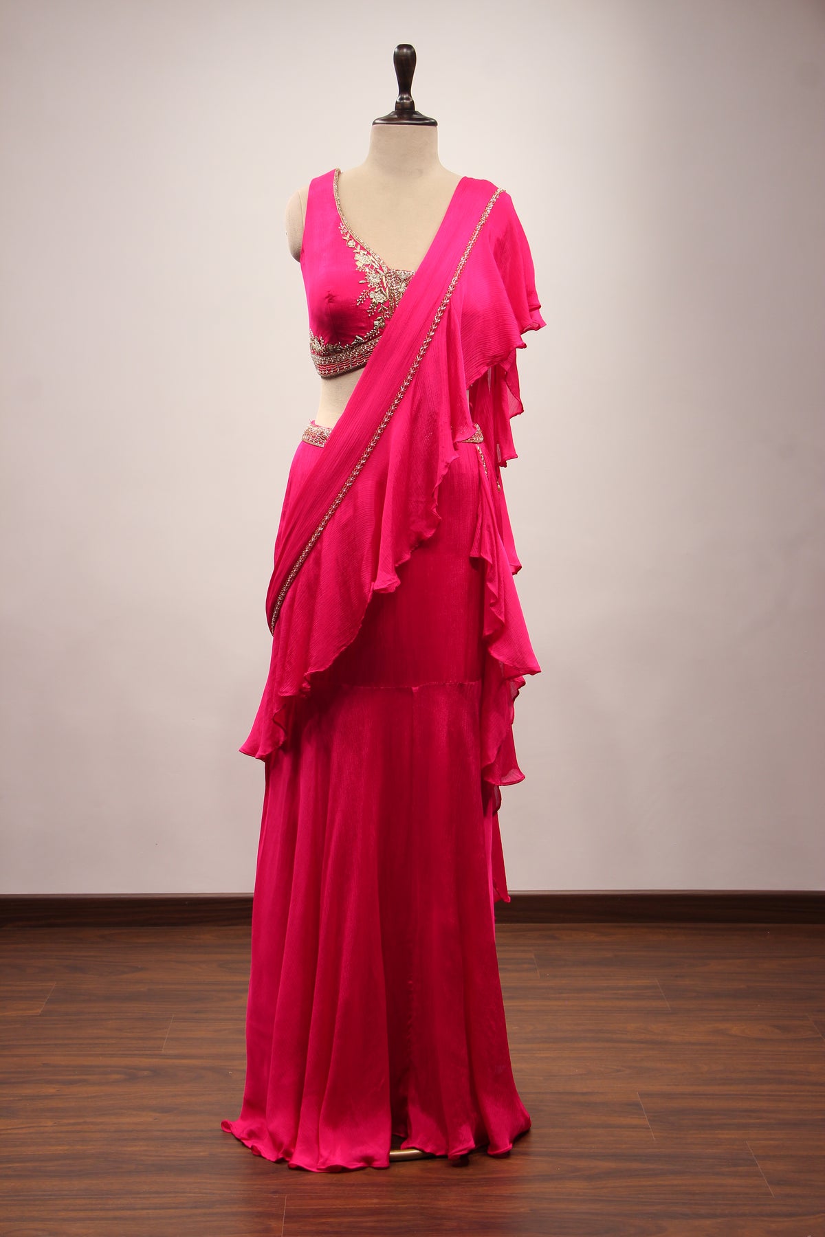 Crepe Ruffle Drape Saree with Zardozi & Bead Handwork V-Neck Crop Top in Pink – front view
