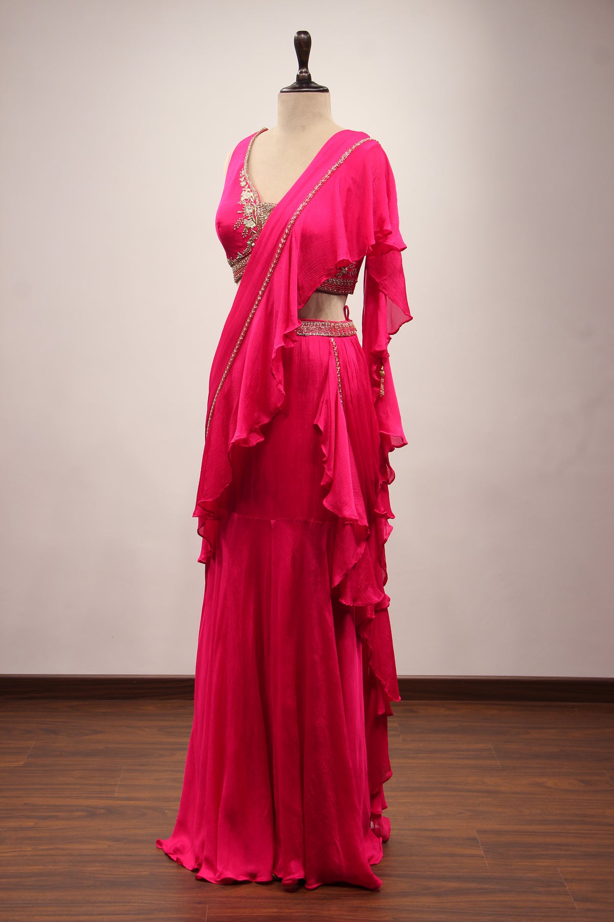 Crepe Ruffle Drape Saree with Zardozi & Bead Handwork V-Neck Crop Top in Pink – side view