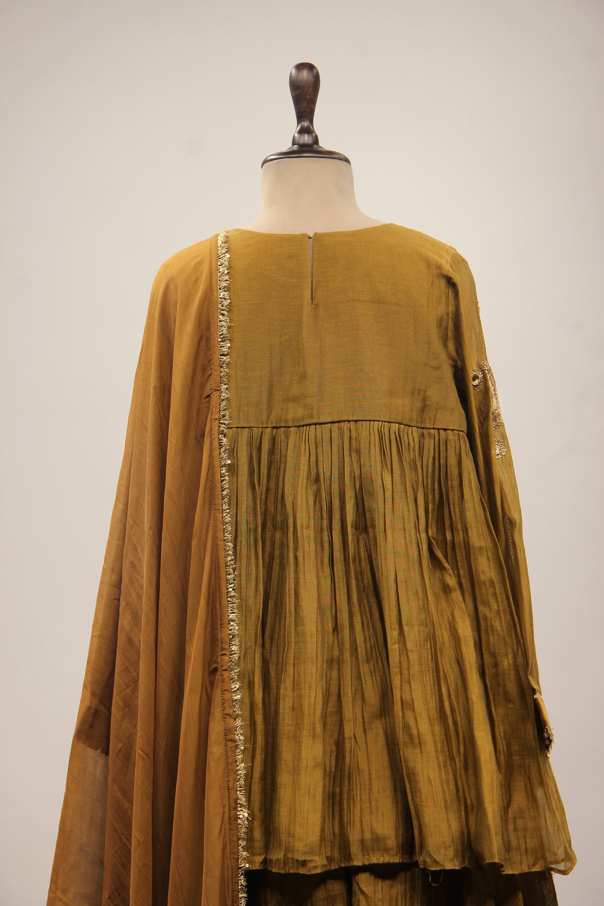 Chanderi Peplum Sharara Suit with Sequin & Zari Handwork Yoke in Green – back close-up