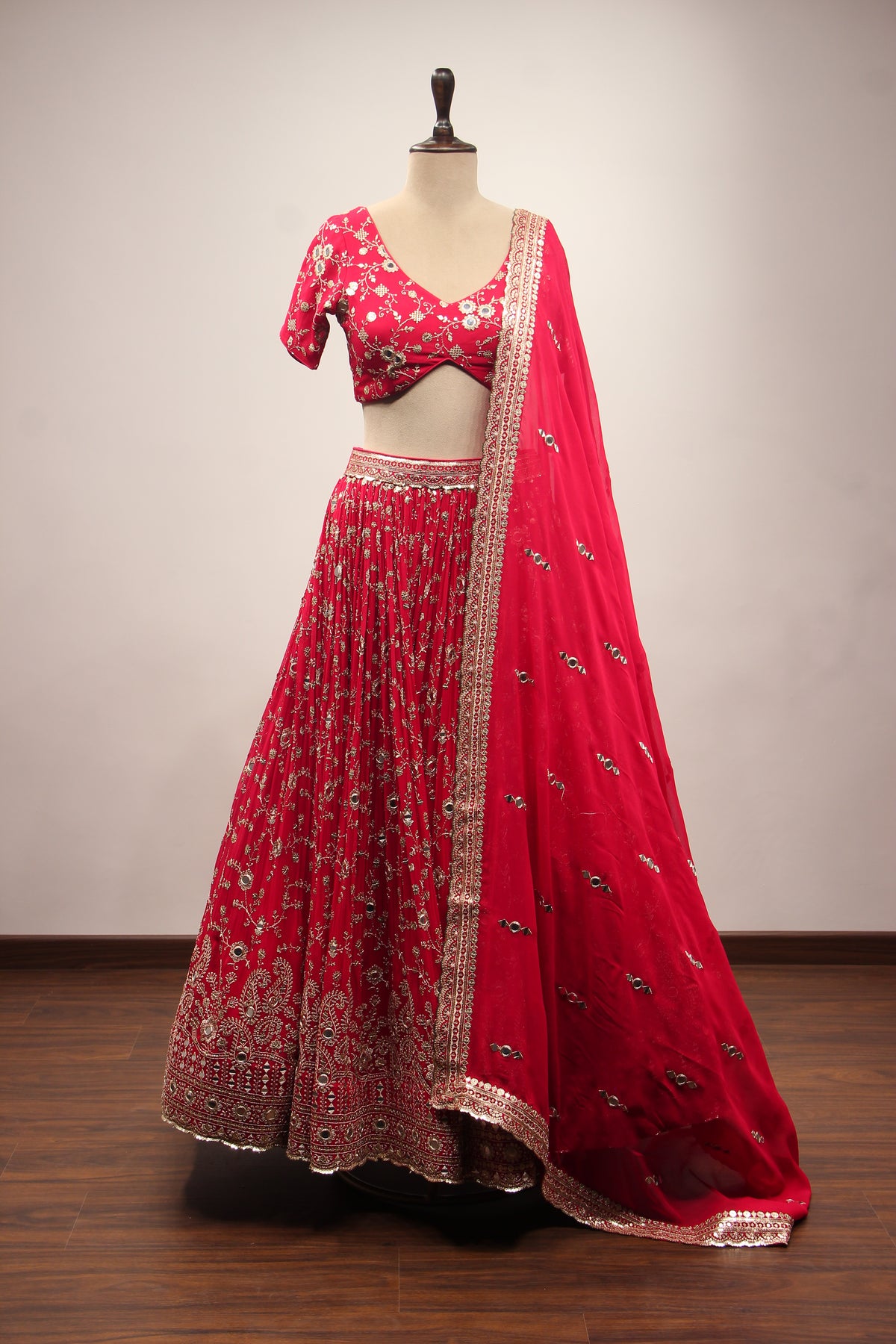 Georgette Lehenga with Mirror & Sequin Handwork Twist Front Crop Top in Red – front view