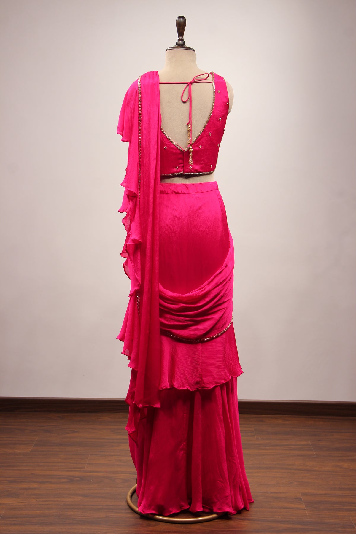 Crepe Ruffle Drape Saree with Zardozi & Bead Handwork V-Neck Crop Top in Pink – back view