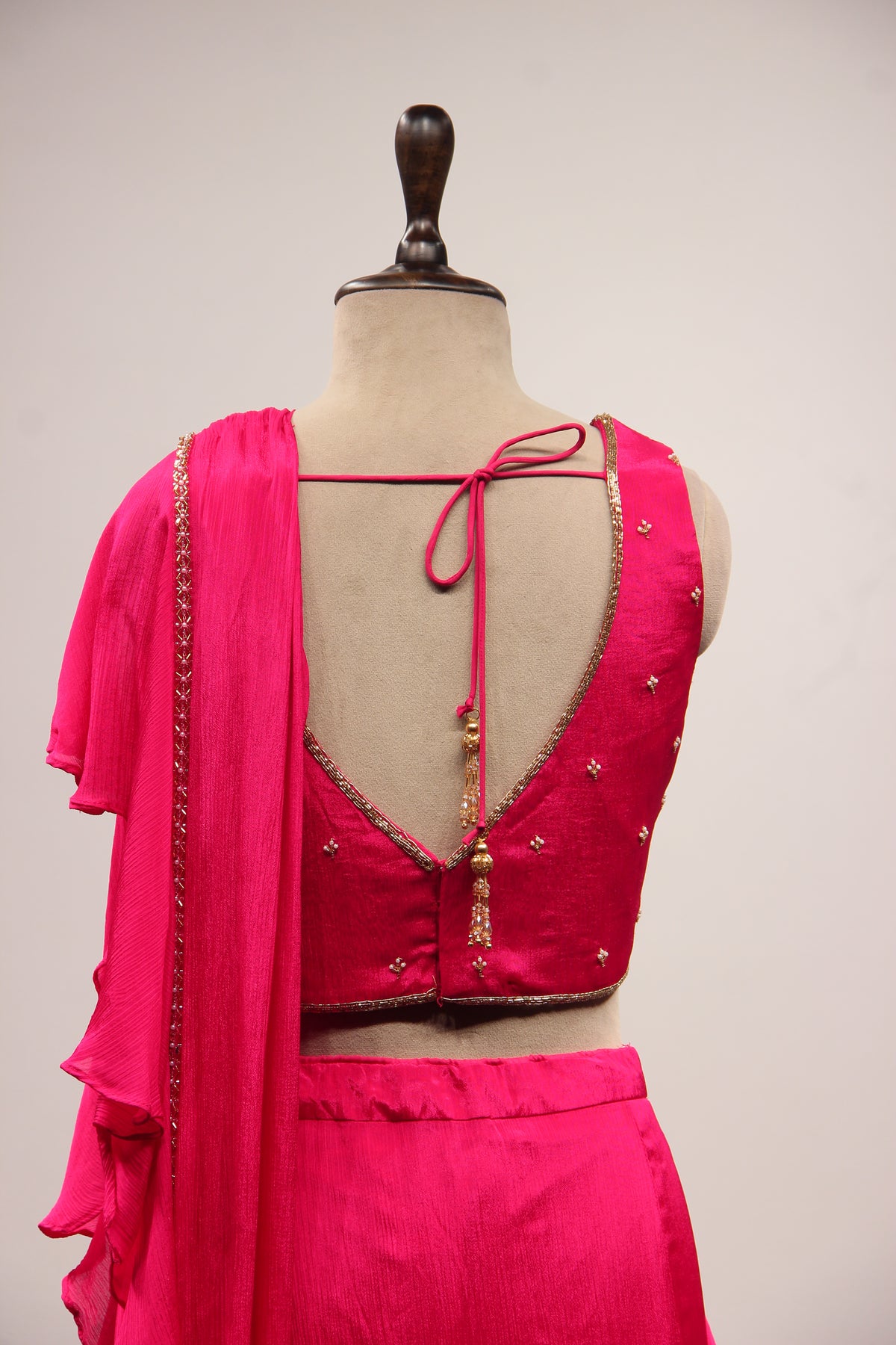 Crepe Ruffle Drape Saree with Zardozi & Bead Handwork V-Neck Crop Top in Pink – back close-up