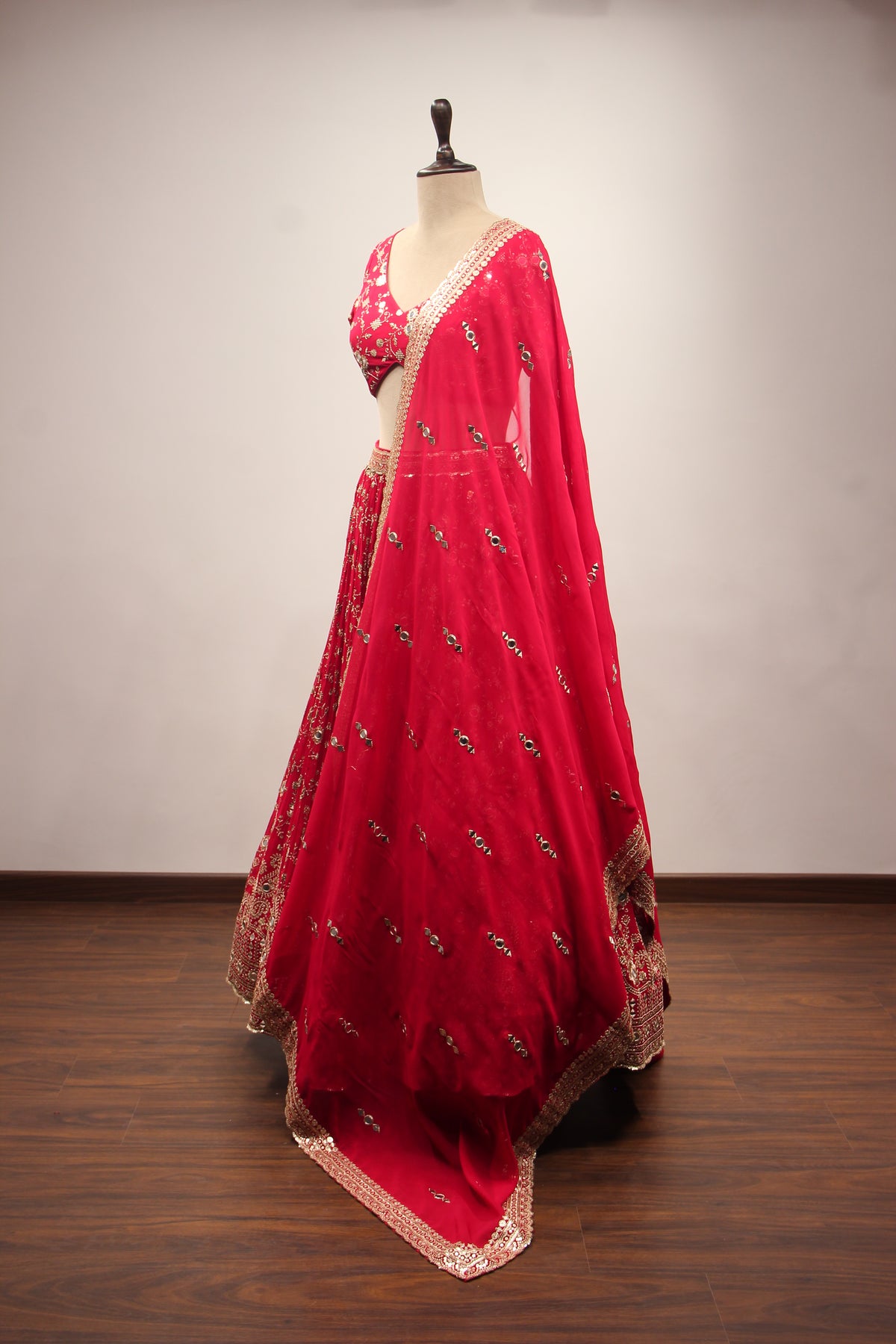 Georgette Lehenga with Mirror & Sequin Handwork Twist Front Crop Top in Red – side view