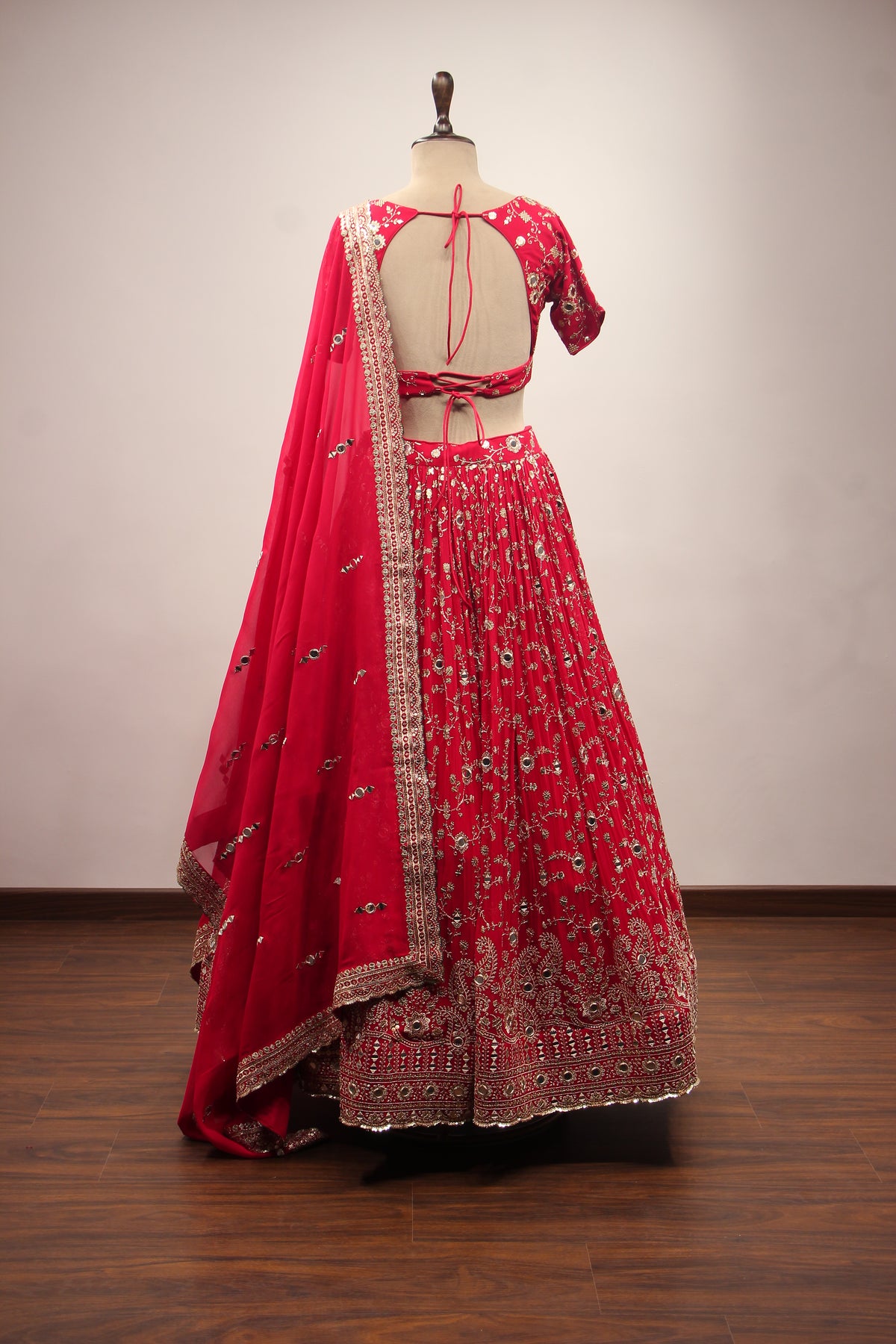 Georgette Lehenga with Mirror & Sequin Handwork Twist Front Crop Top in Red – back view