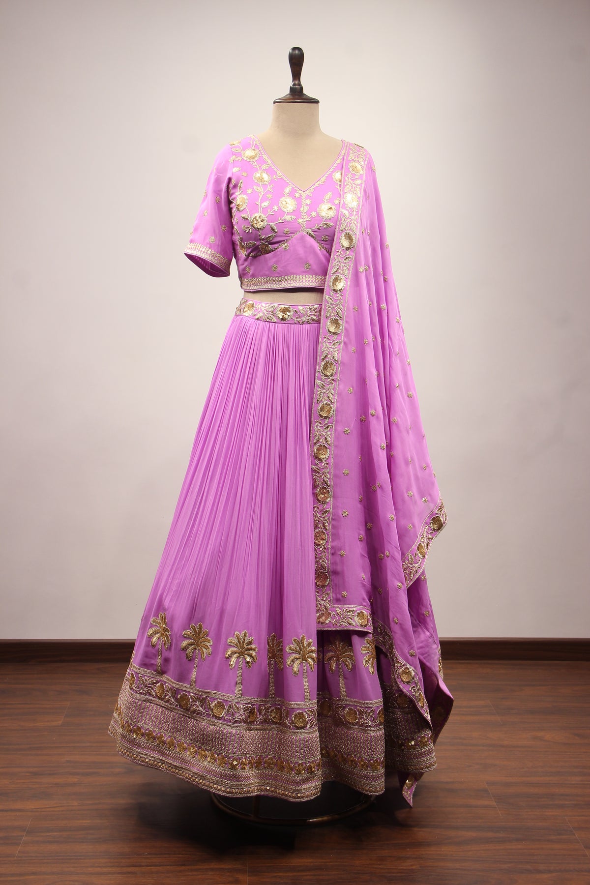 Georgette Crop Top Lehenga with Hand Embroidery & Zari Handwork in Purple – front view