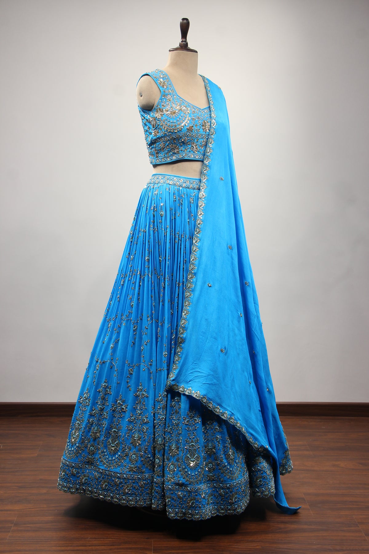 Turquoise Crepe Crop Top Lehenga in Hand Embroidery & Zardozi Handwork – side view