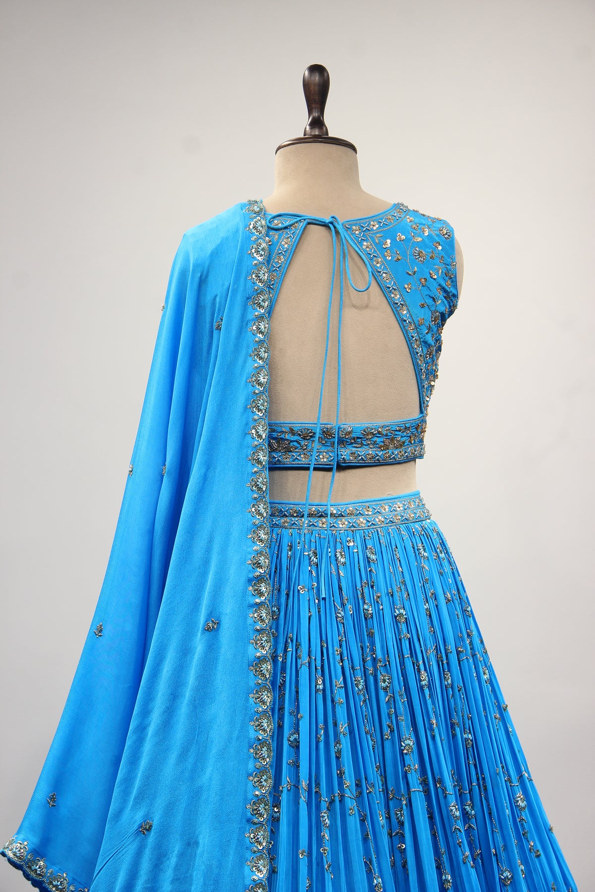Turquoise Crepe Crop Top Lehenga in Hand Embroidery & Zardozi Handwork – back close-up