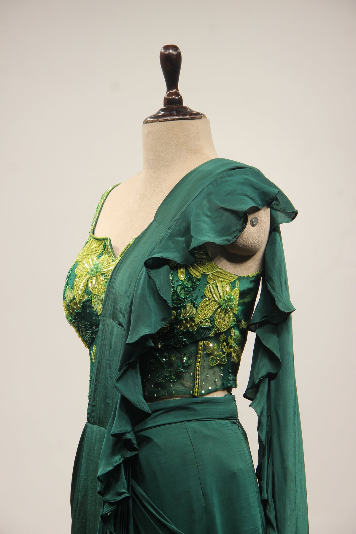 Bottle Green Crepe Drape Saree with Printed Cut Dana Handwork Corset – side close-up