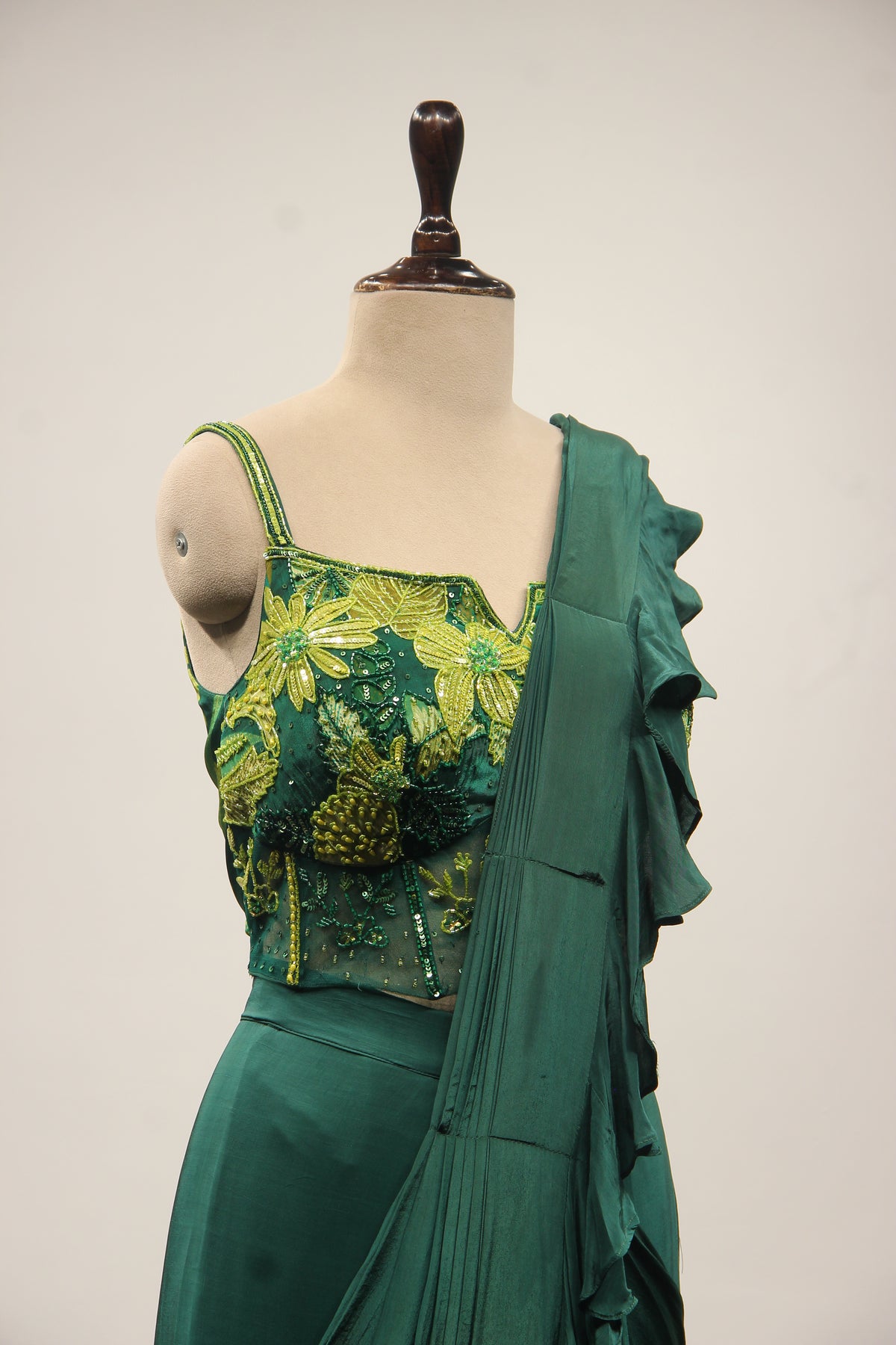 Bottle Green Crepe Drape Saree with Printed Cut Dana Handwork Corset – other side close-up