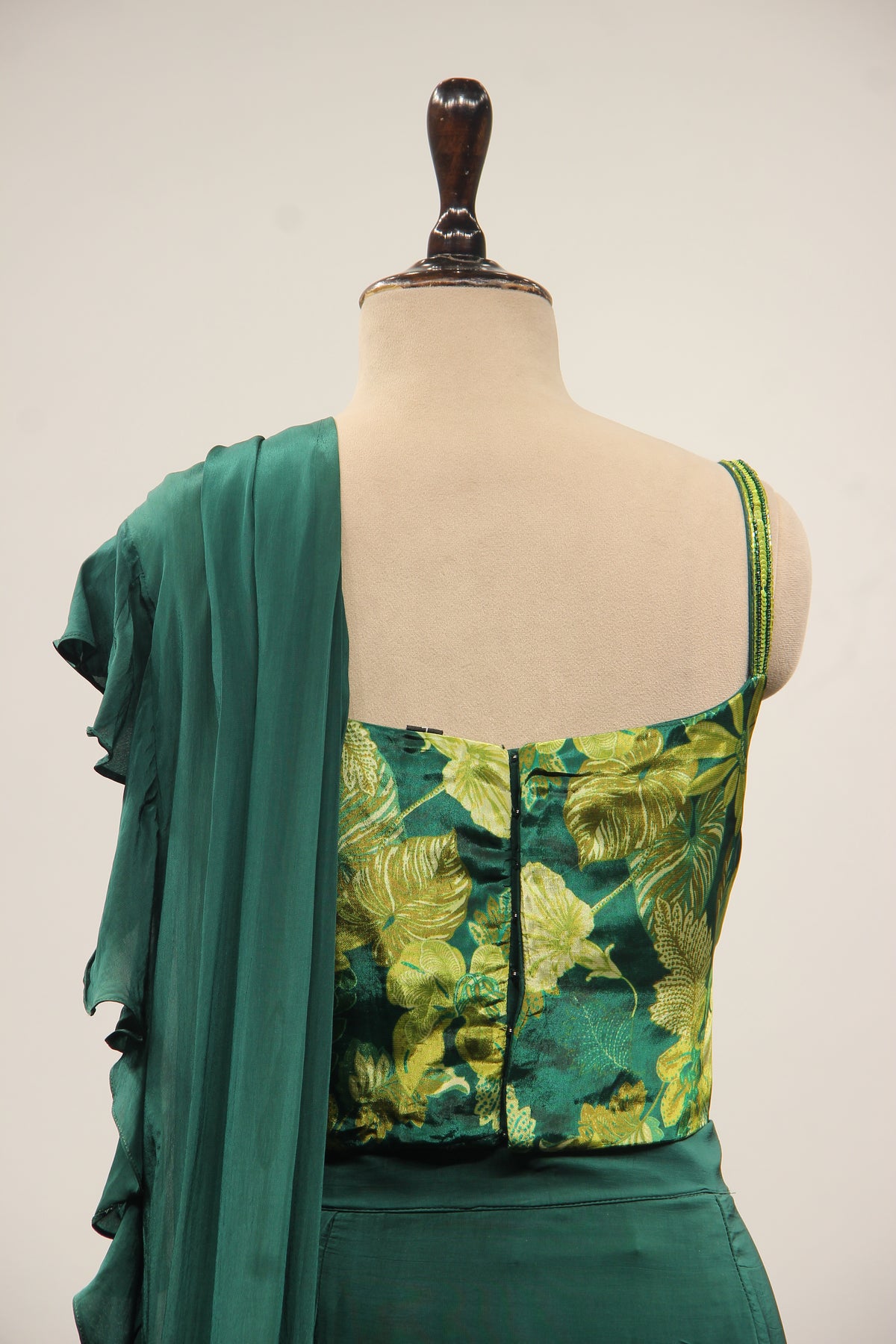 Bottle Green Crepe Drape Saree with Printed Cut Dana Handwork Corset – back close-up