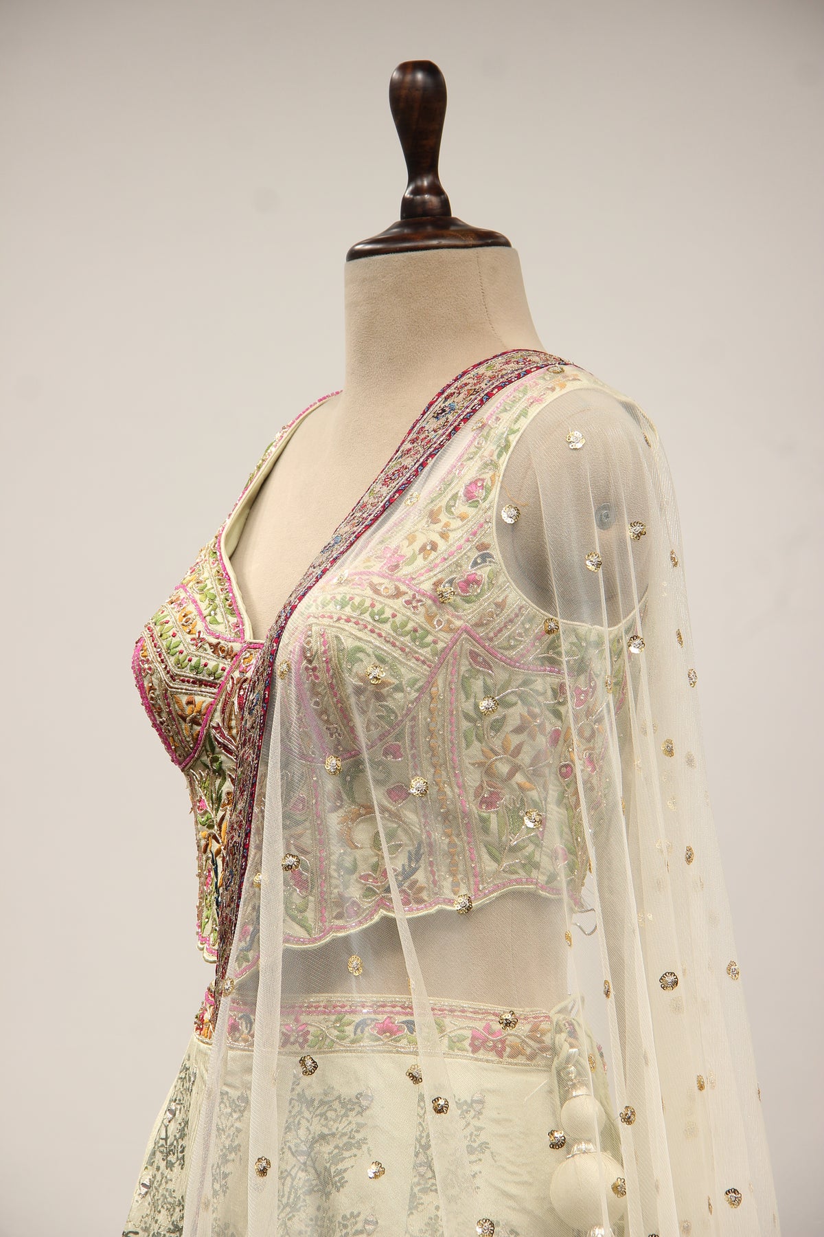 Pista Green Printed Silk Lehenga with Hand Embroidery Corset Blouse – side close-up