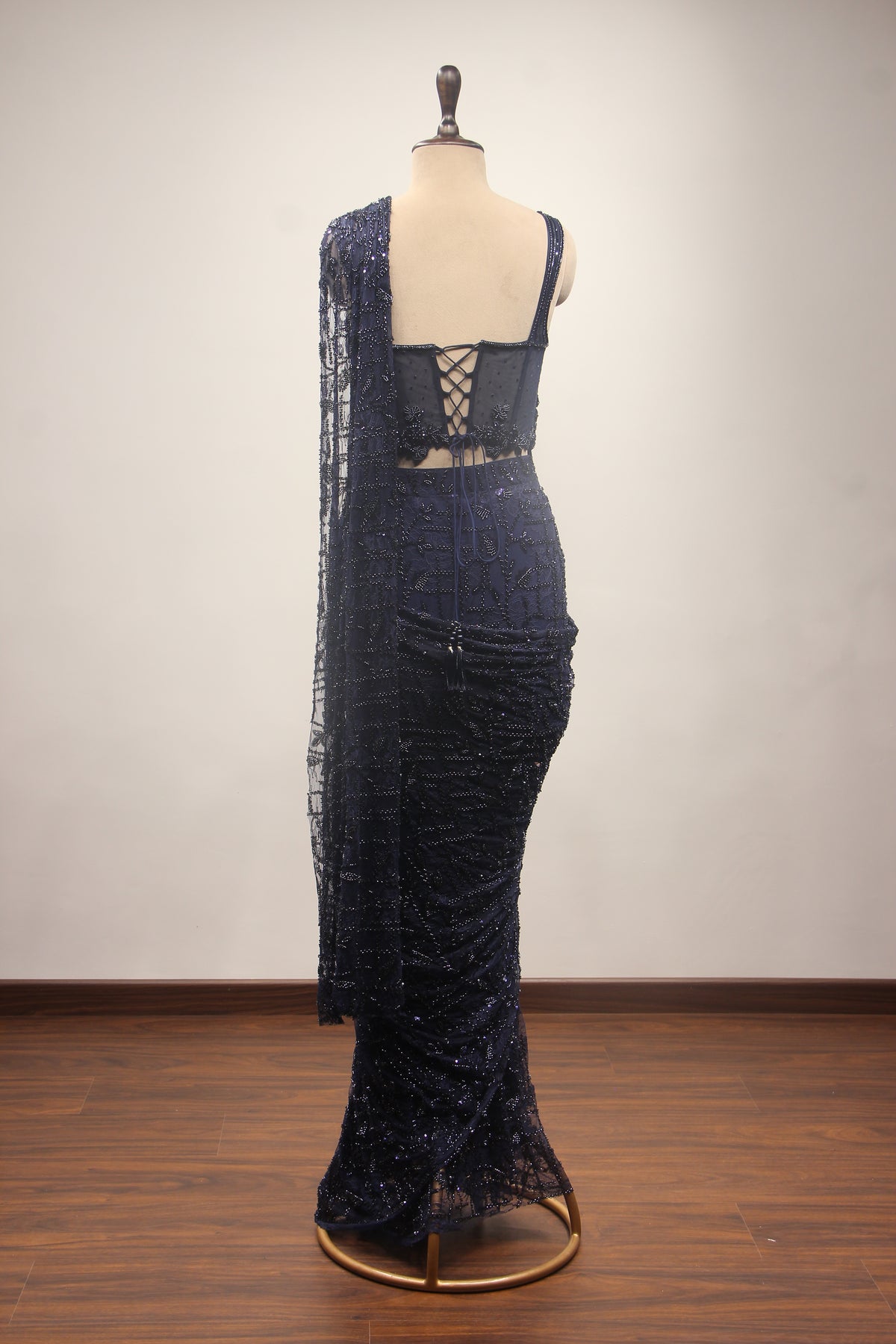 Imported Drape Saree with Cut Dana & Bead Handwork Net Corset Blouse in Blue – back view