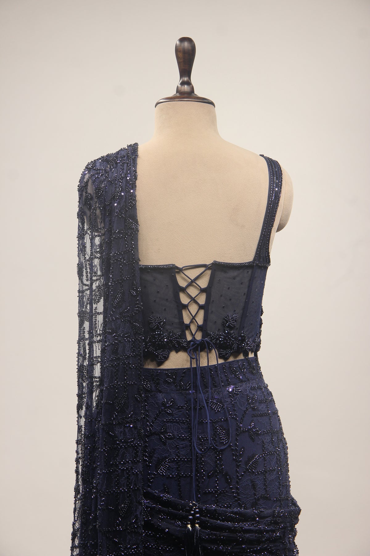 Imported Drape Saree with Cut Dana & Bead Handwork Net Corset Blouse in Blue – back close-up