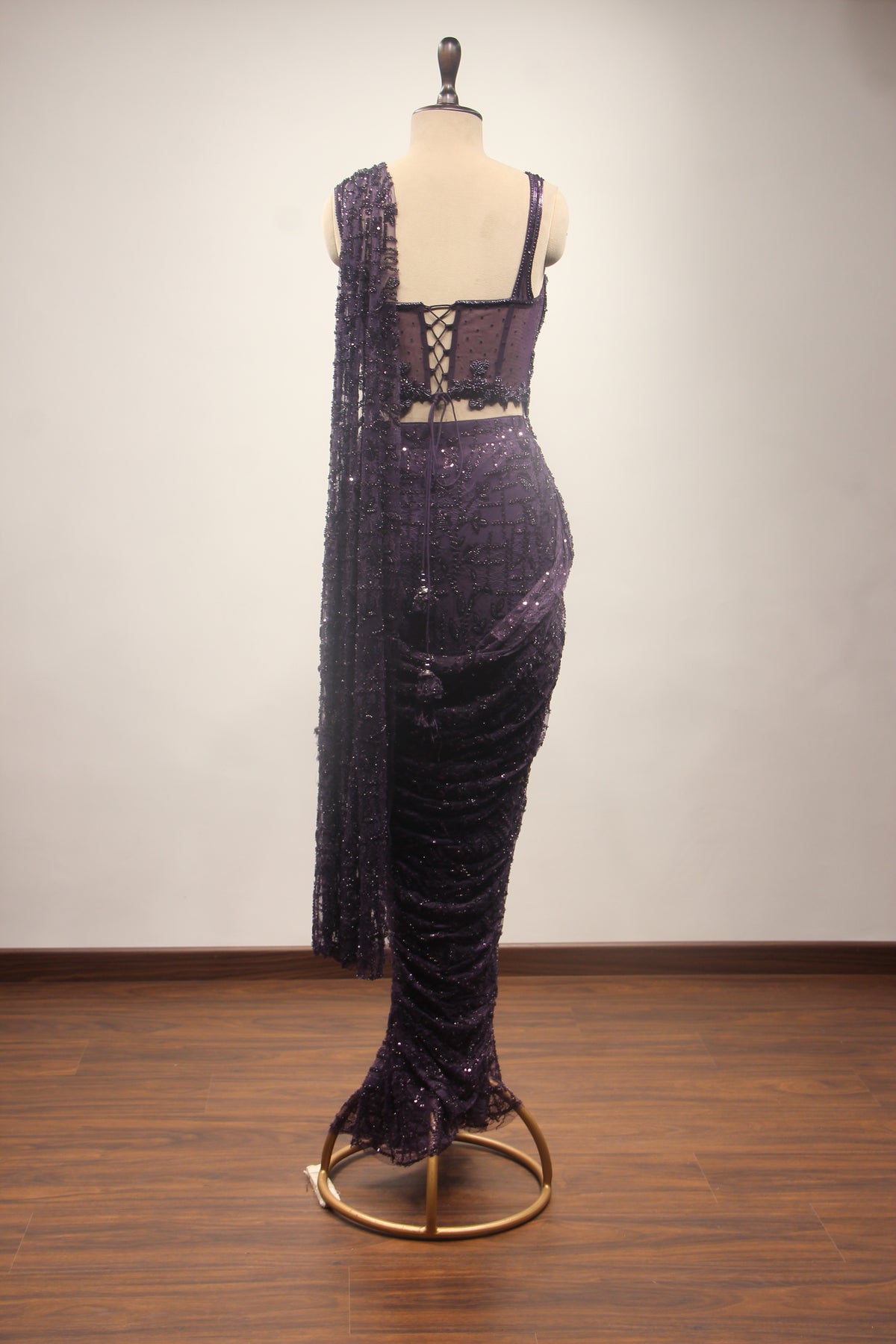 Imported Drape Saree with Cut Dana & Bead Handwork Net Corset Blouse in Purple – back view