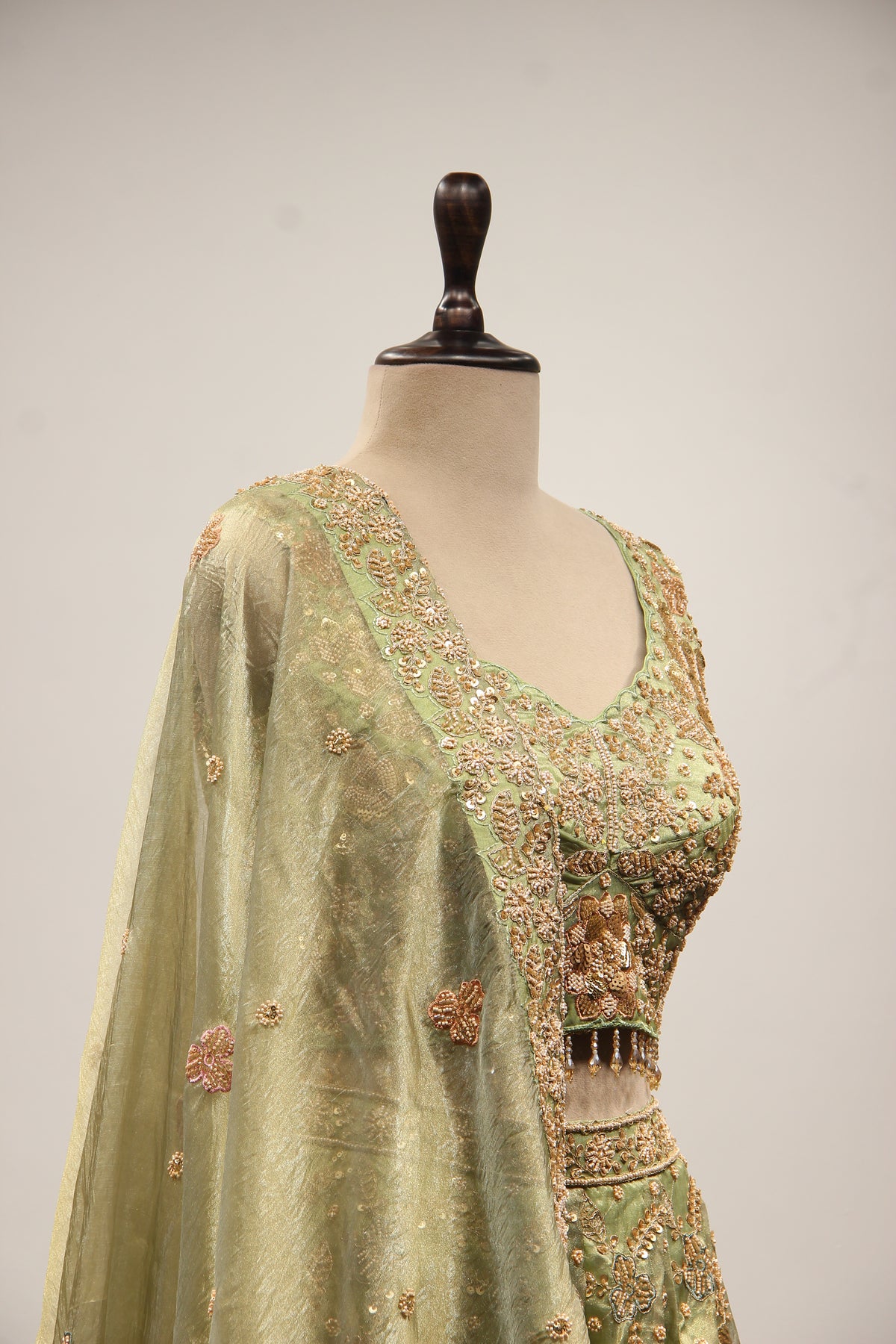 Green Shimmer Organza Lehenga with Bead & Zari Handwork Crop Top – side close-up