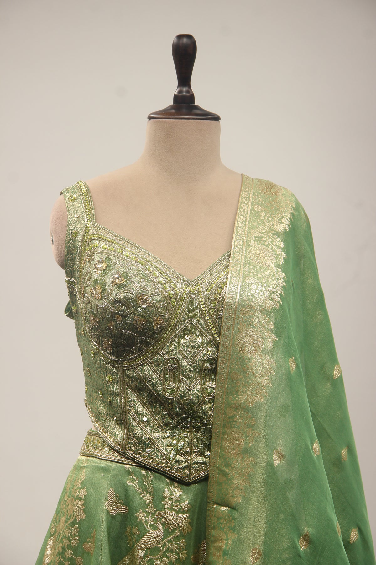 Green Banarasi Brocade Lehenga with Zardozi & Cut Dana Handwork Corset – front close-up