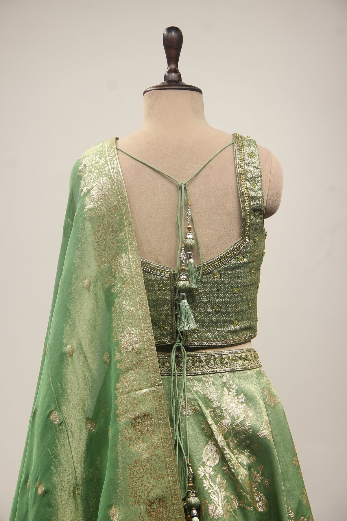 Green Banarasi Brocade Lehenga with Zardozi & Cut Dana Handwork Corset – back close-up