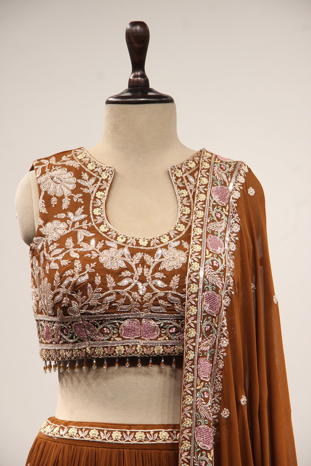 Georgette Lehenga with Resham & Cut Dana Handwork and Beaded Crop Top in Brown – front close-up