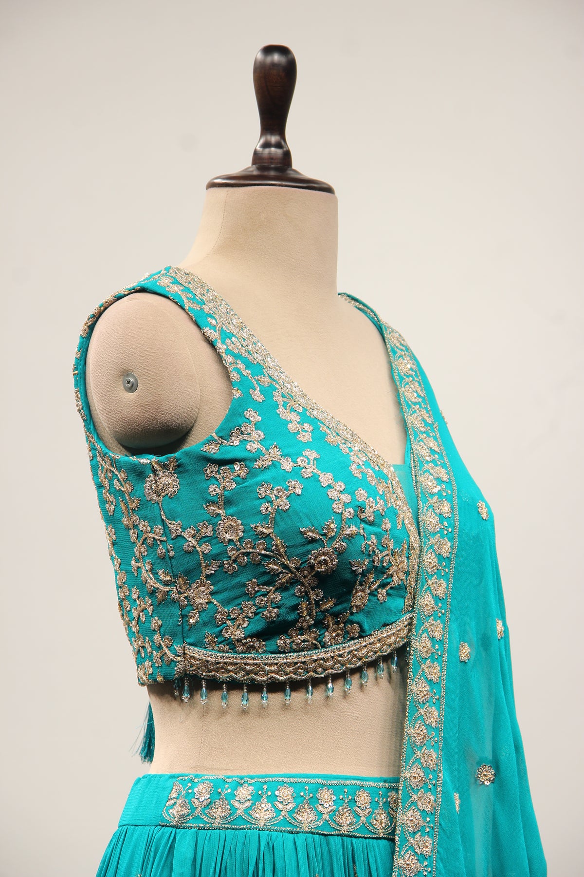Georgette Lehenga with Zari & Sequin Handwork Plunge V-Neck Crop Top in Green – other side close-up