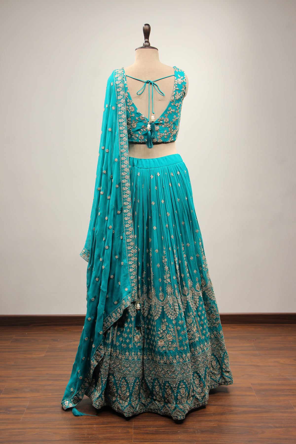 Georgette Lehenga with Zari & Sequin Handwork Plunge V-Neck Crop Top in Green – back view