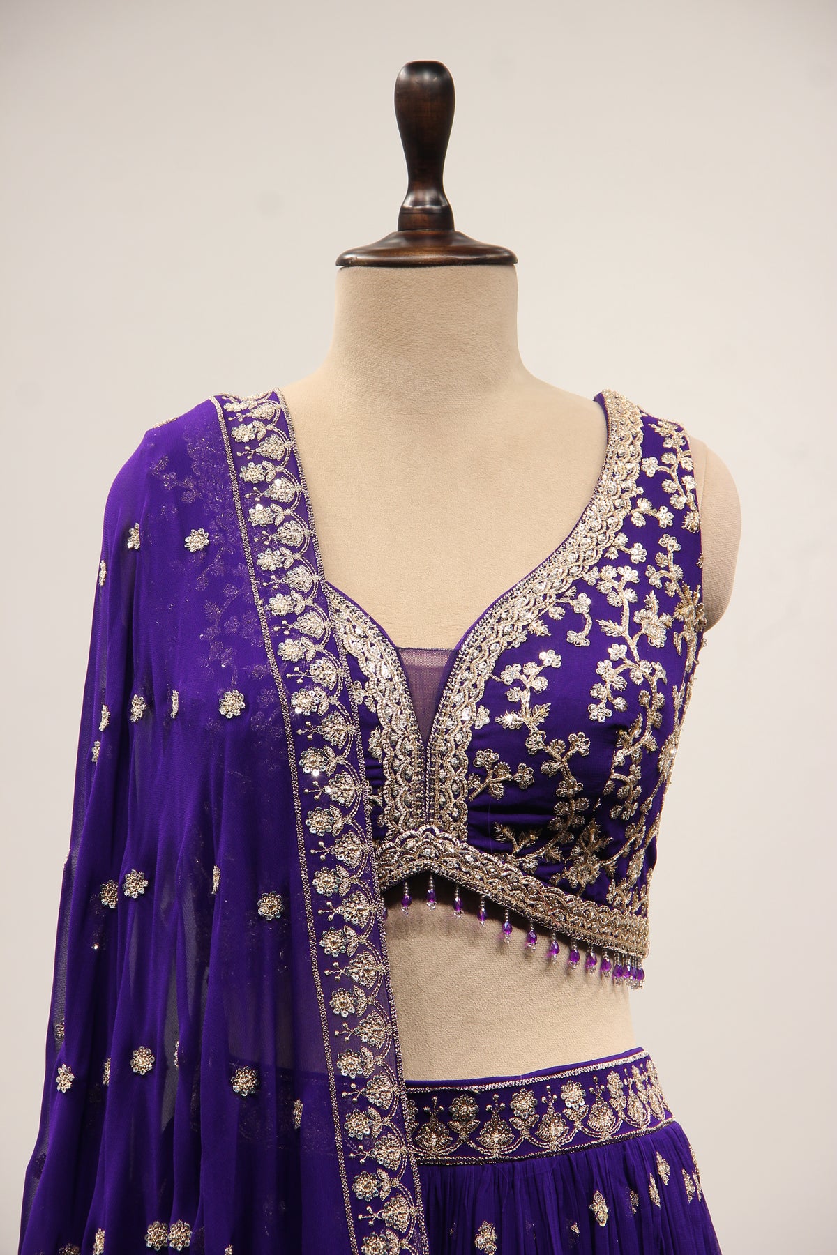 Georgette Lehenga with Zari & Sequin Handwork Plunge V-Neck Crop Top in Purple – front close-up