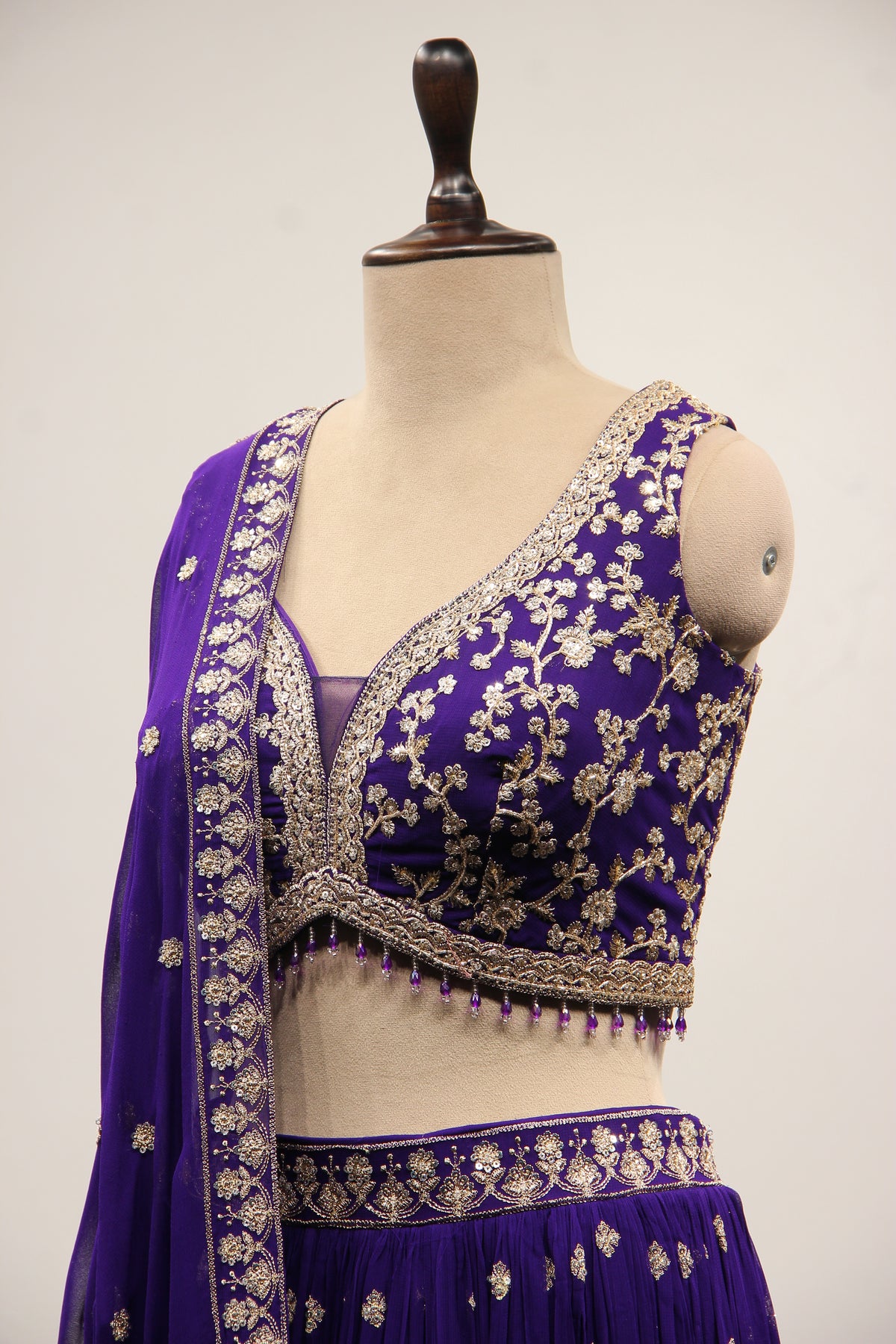 Georgette Lehenga with Zari & Sequin Handwork Plunge V-Neck Crop Top in Purple – side close-up