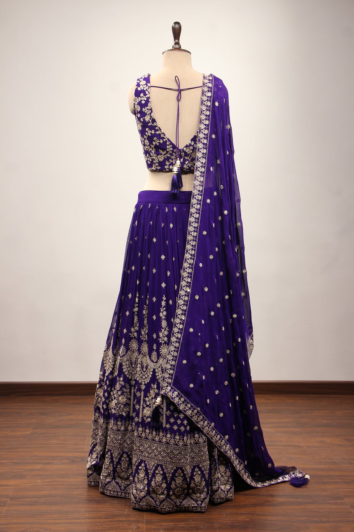 Georgette Lehenga with Zari & Sequin Handwork Plunge V-Neck Crop Top in Purple – back view