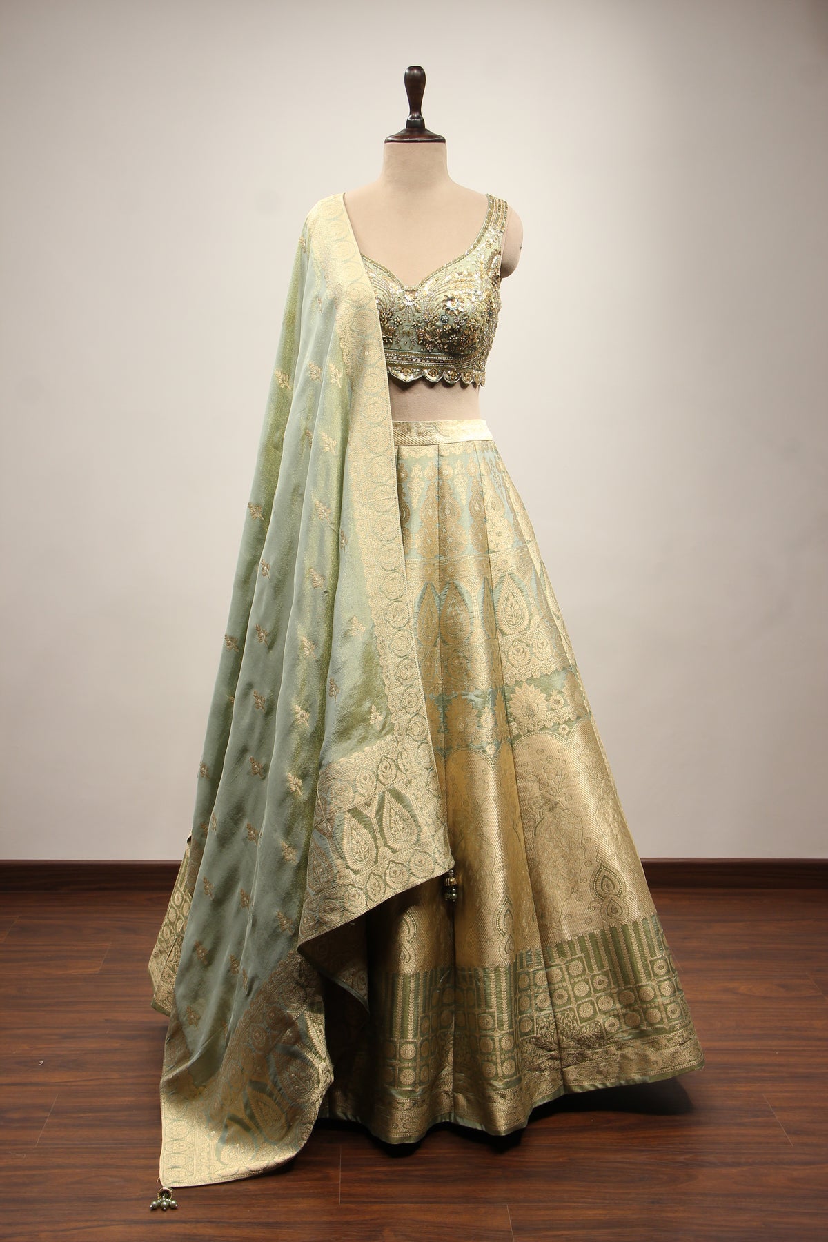 Pista Green Banarasi Brocade Lehenga with Hand Embroidery & Cut Dana – front view
